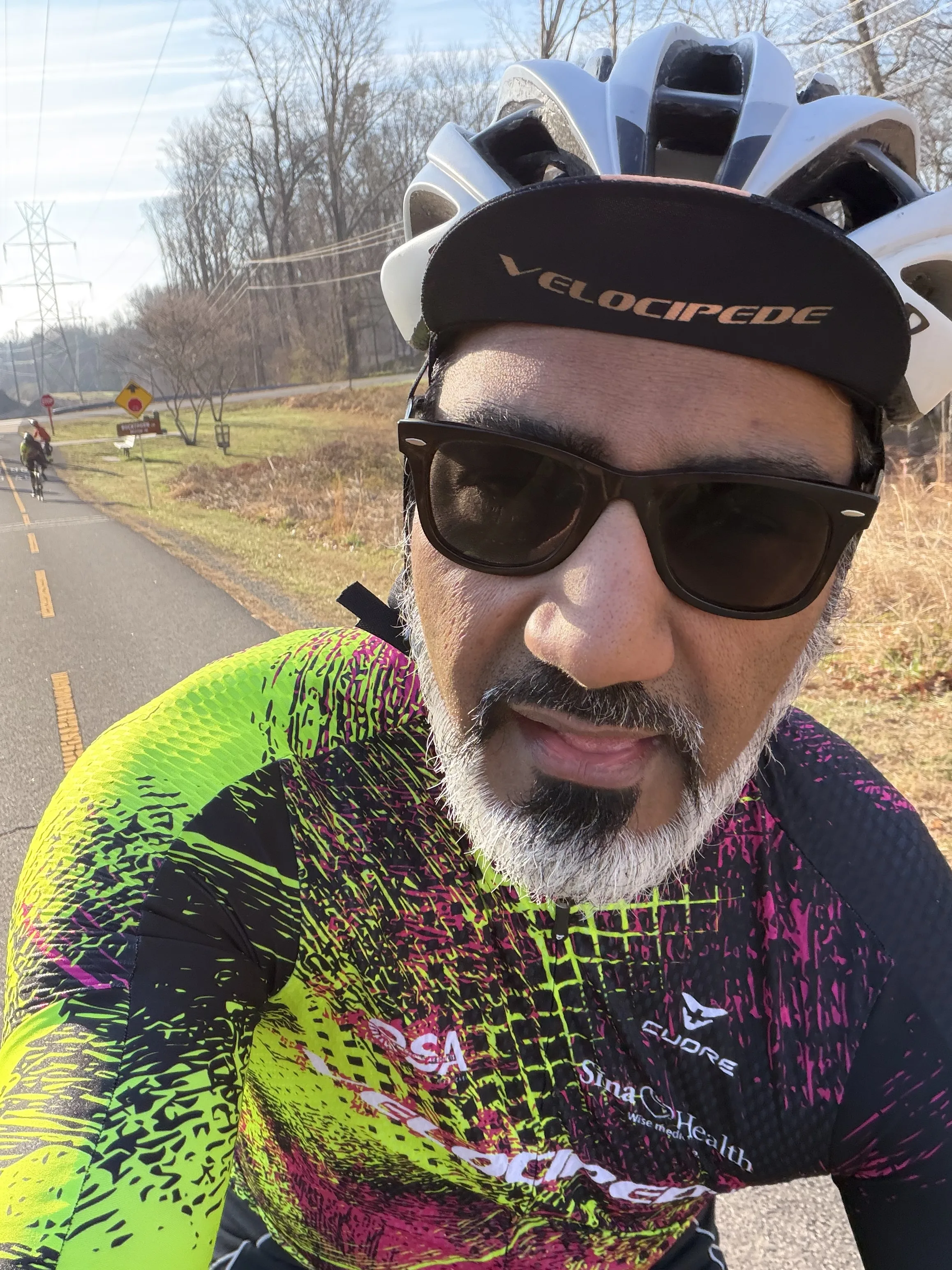 Junaid Ahmed cycling on a trail